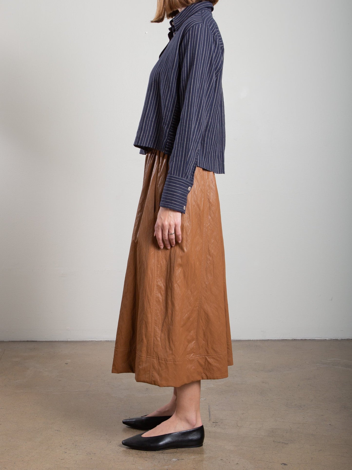 Pharaoh Claudia Skirt in Chestnut faux leather, side panel seam detail