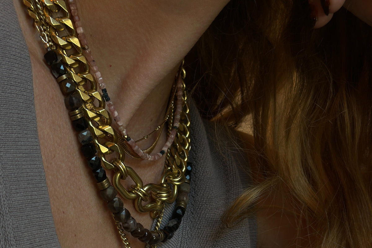 Rachel Nathan Petrified Wood & Tourmaline necklace shown on model, close view at the neckline