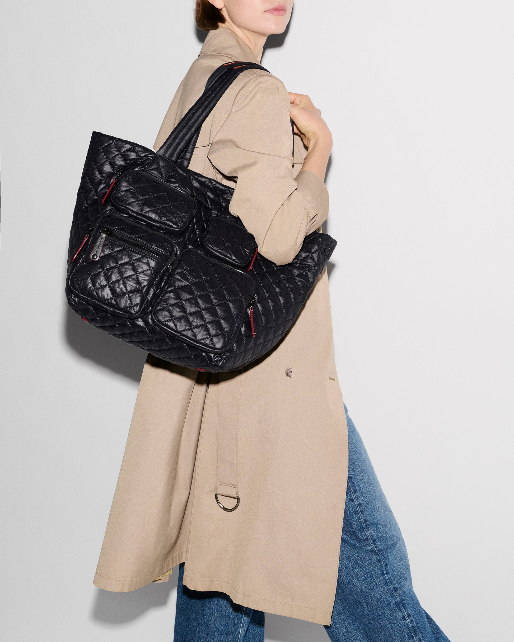 MZ Wallace Medium Metro Travel Tote in black, carried by a model