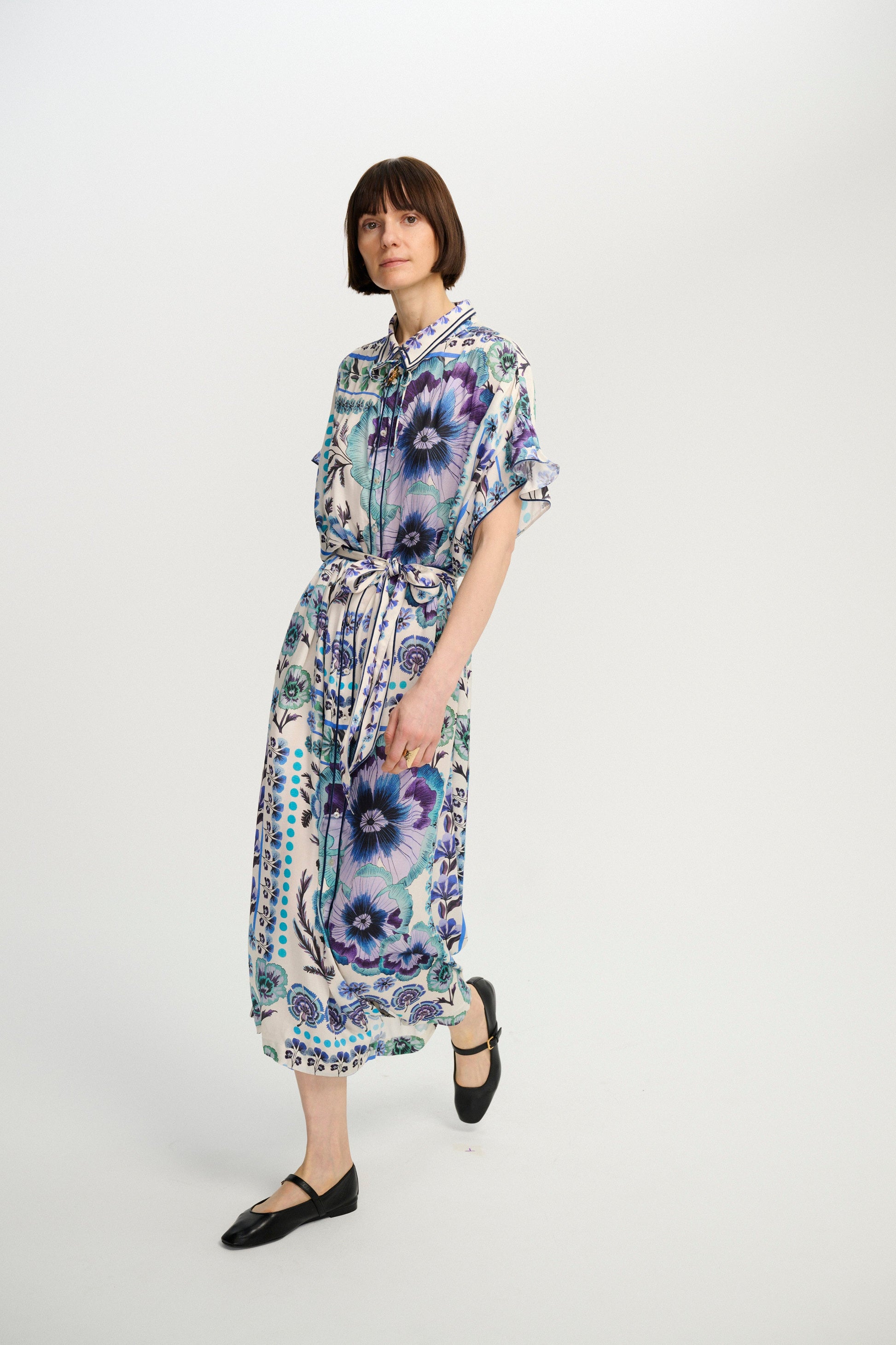 Carolina K Lynn Kaftan in Antique Floral Blue, worn with the self-tie belt
