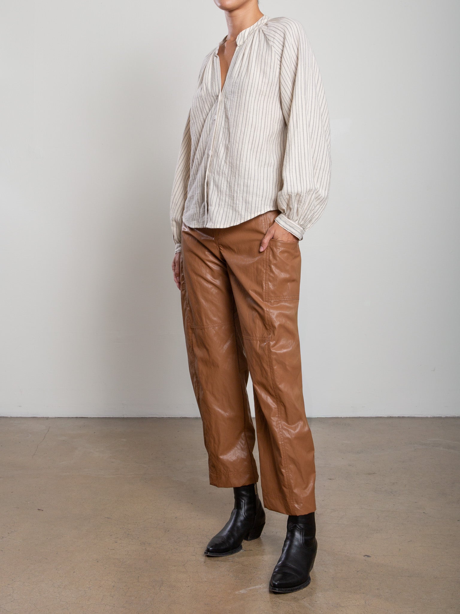 Pharaoh Torrance Pant in Chestnut faux leather, side view showing barrel leg
