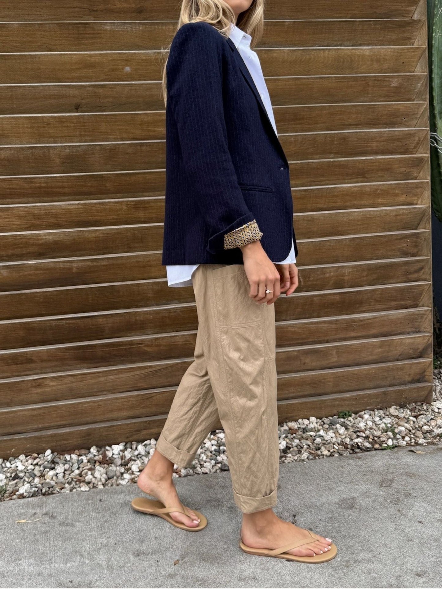 Pharaoh Torrance Pant in Biscotti faux leather, side view showing barrel leg