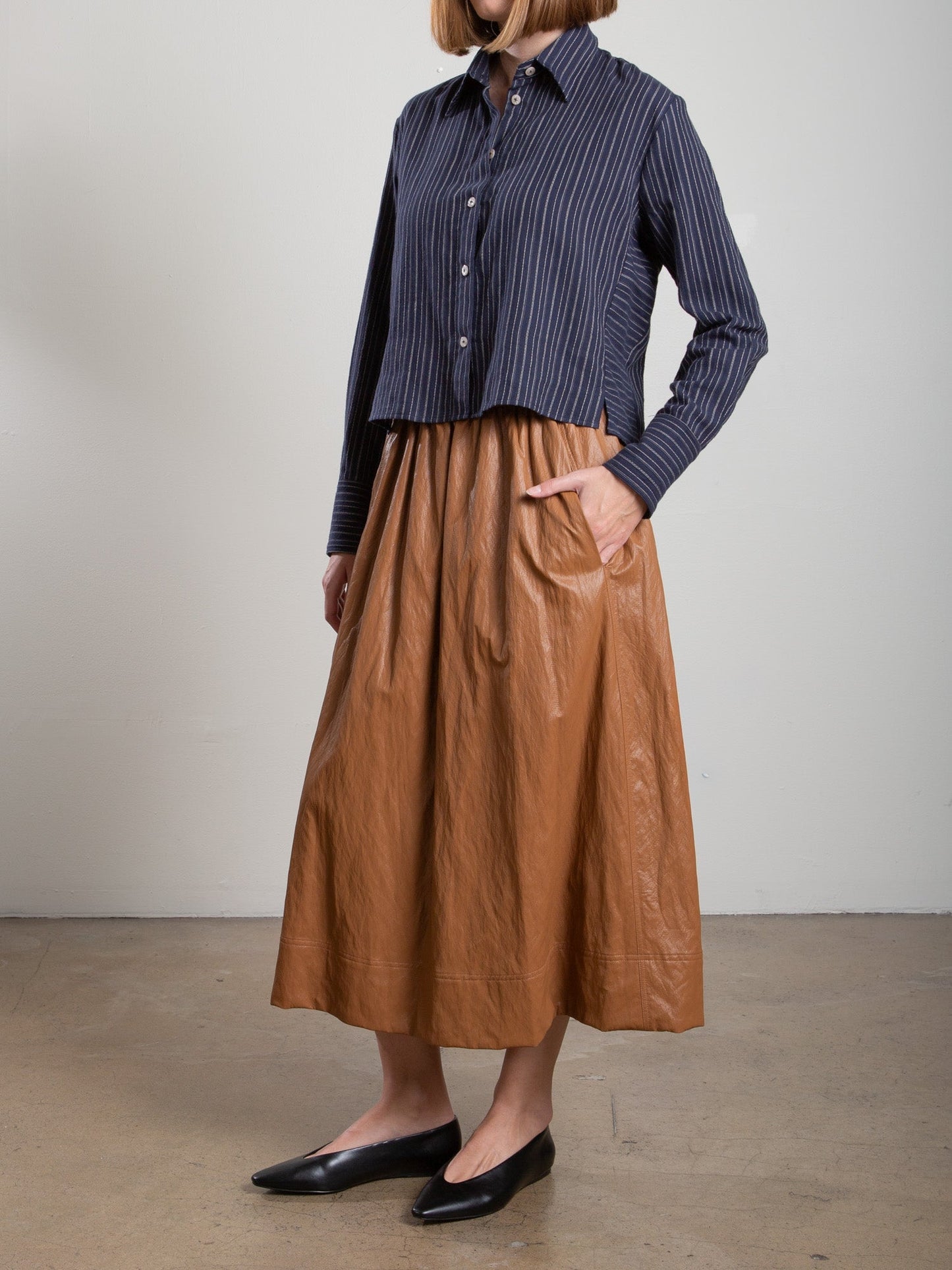 Pharaoh Claudia Skirt in Chestnut faux leather, styled full length