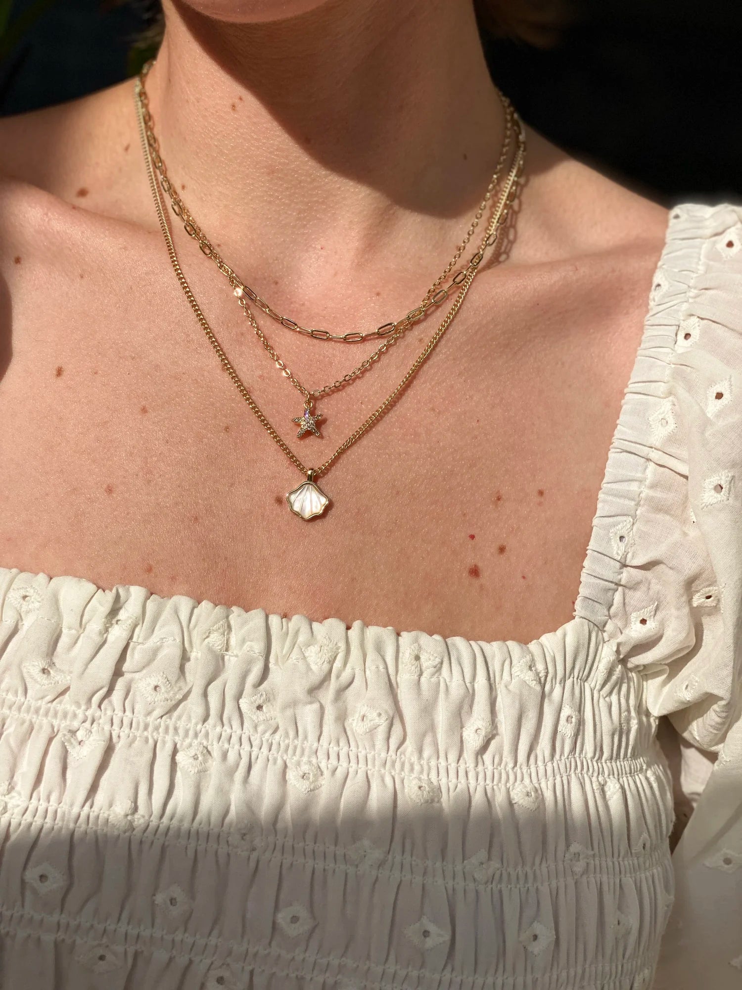 Rachel Nathan Mother of Pearl Seashell necklace shown on model