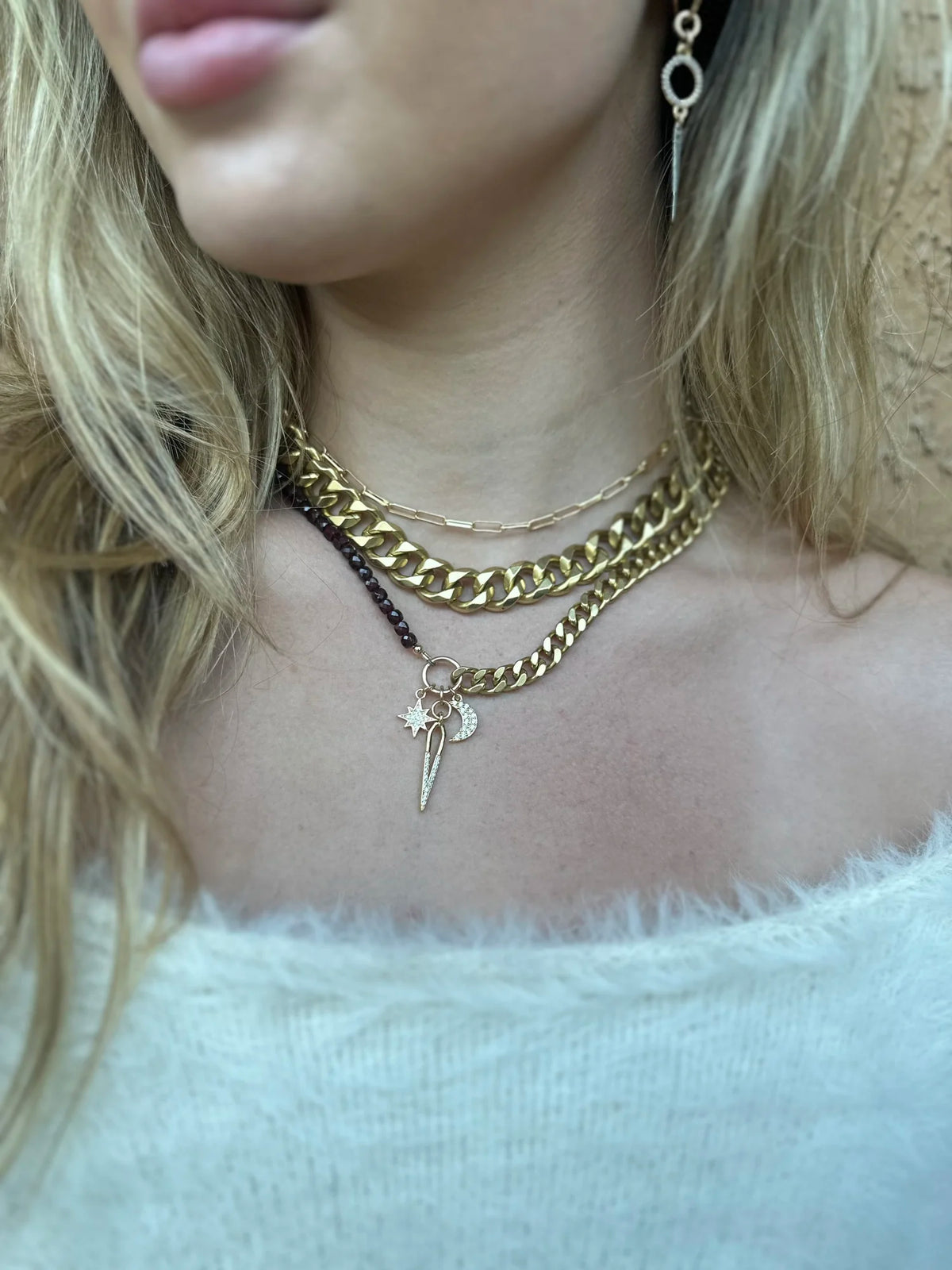 Rachel Nathan Garnet & Celestial Charms necklace shown on model