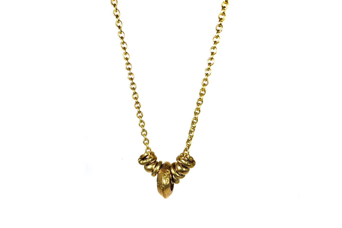 Rachel Nathan Wander Rings necklace, full front view of sculpted Indian brass rings on a long brass oval chain