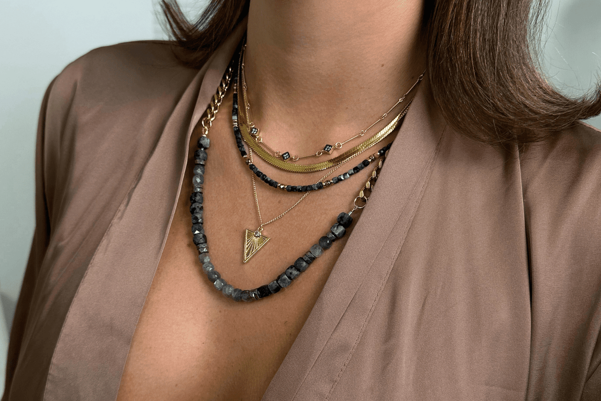 Rachel Nathan Mini Beaded Blue Sapphire & Pyrite necklace shown on model, layered