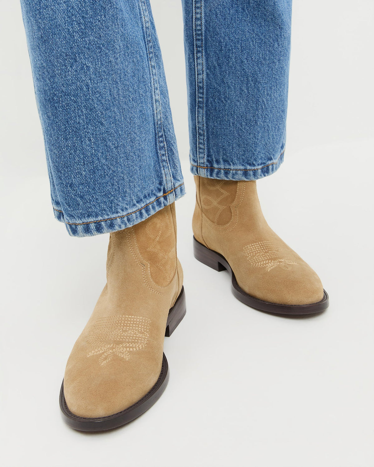 Loeffler Randall Jett Western Calf Boot in Sand suede, shown on model with jeans